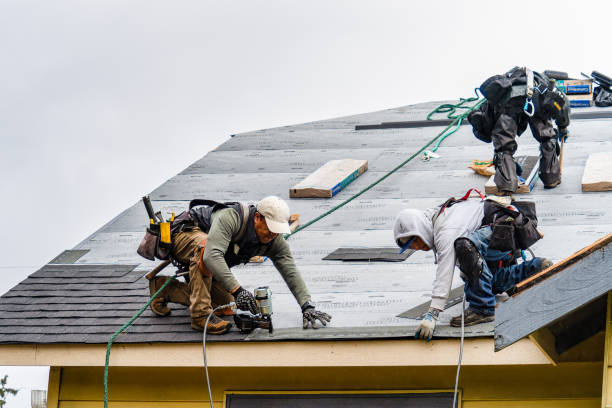Professional Roofing technician working in Winchester Center, CT